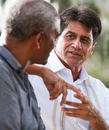 Man listening to senior man