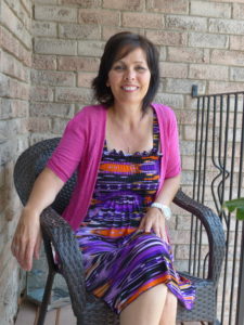 Photo of nursing patient Lorraine Demers enjoying the warm weather on her porch.